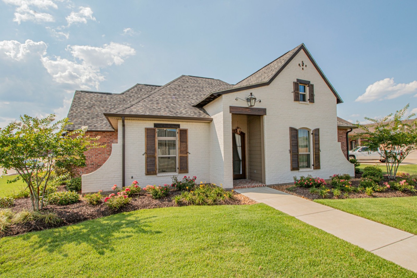 Polished market-ready single-family home exterior with professional landscaping